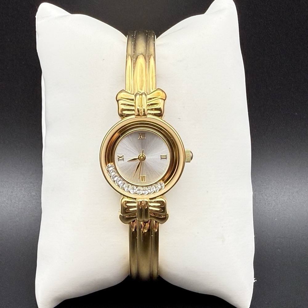 Vintage Y2K Gold Tone Bow Accent Bangle Watch Rhinestone Bezel Roman Numeral